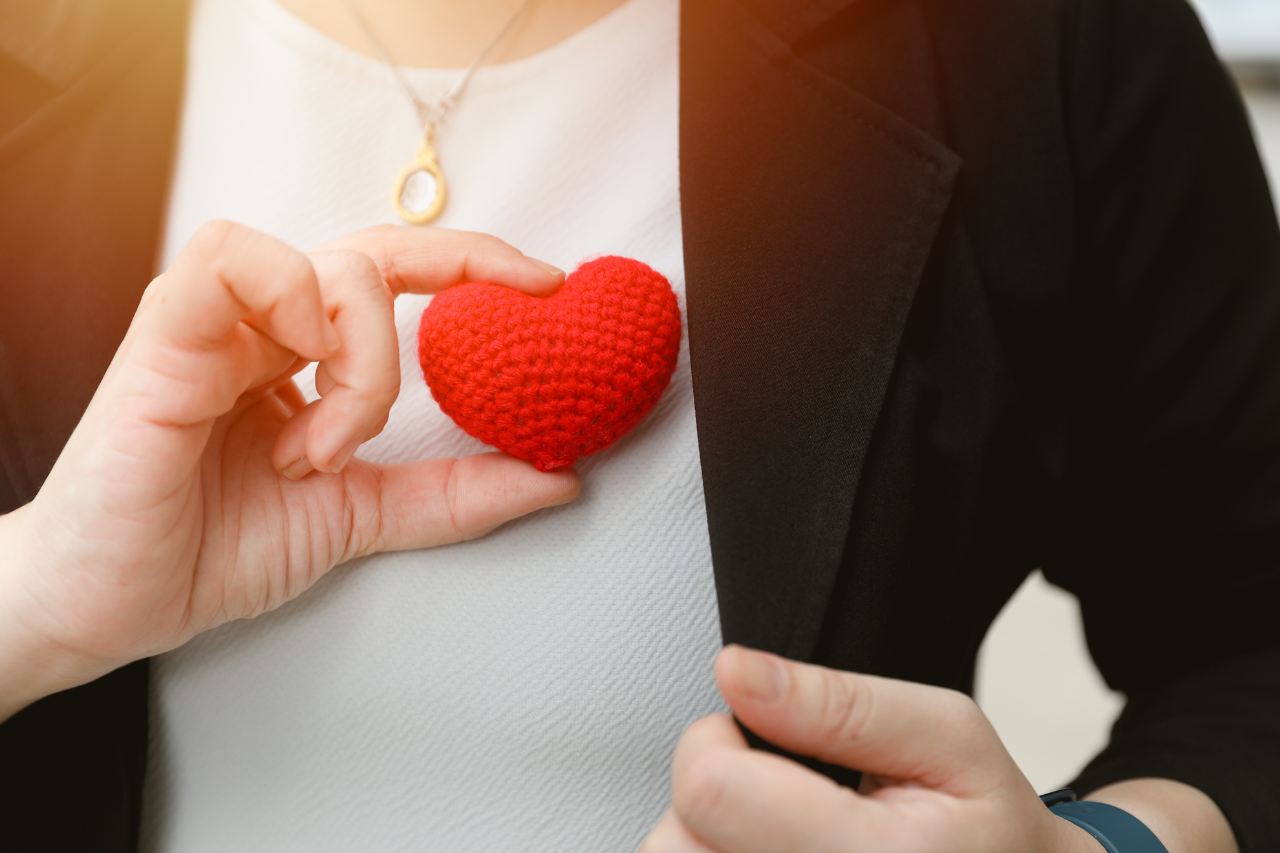Women holding a heart