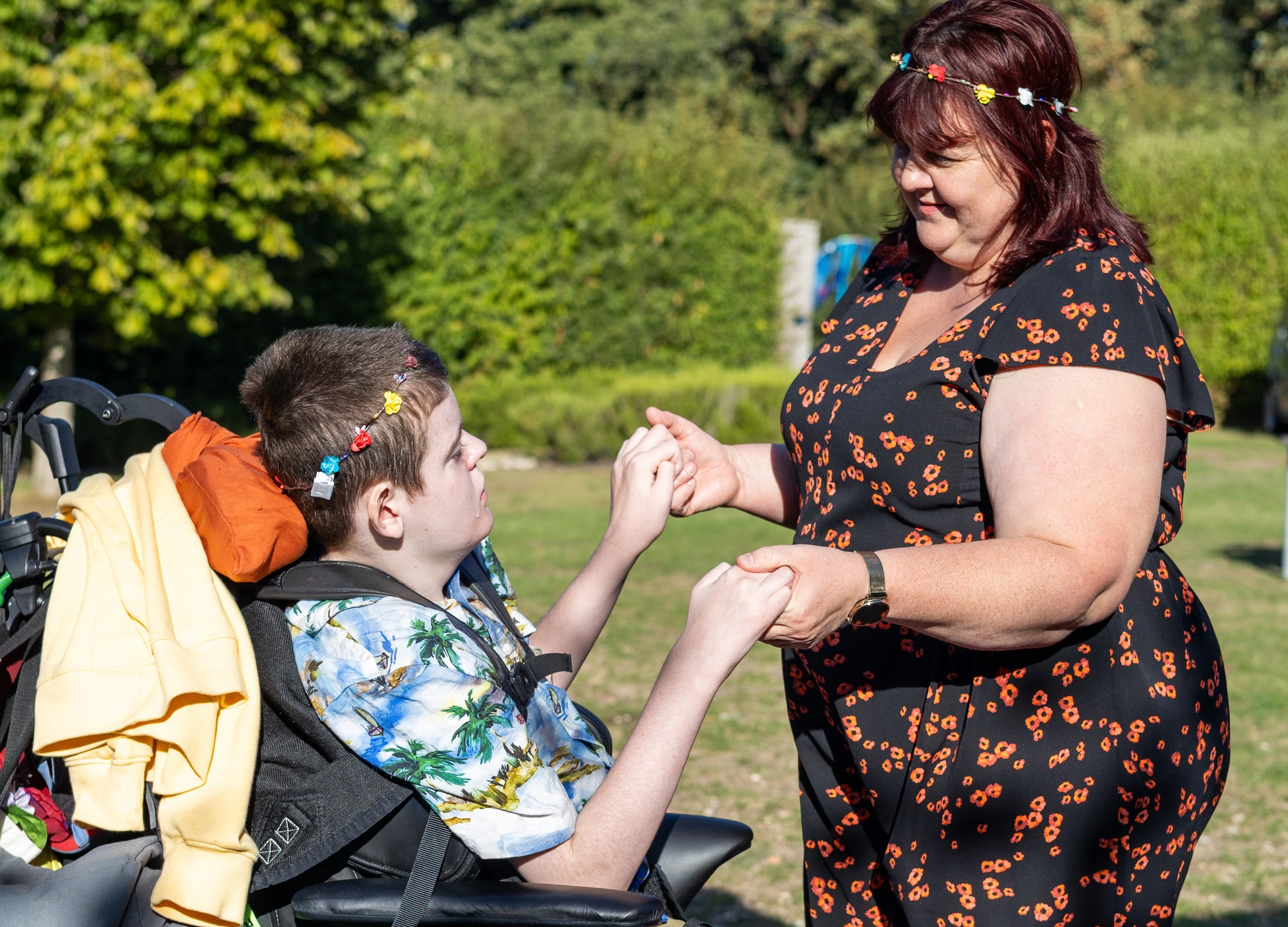 Mother and son holding hands